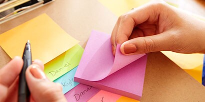 layer each Post-it® Note one on top of each other onto a clipboard