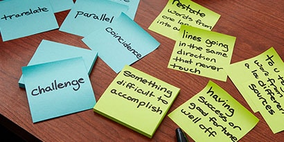 Write a word on a Post-it® Super Sticky Note