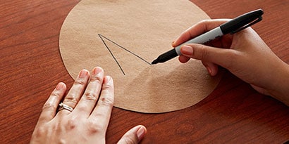 Write a very common word on the brown paper